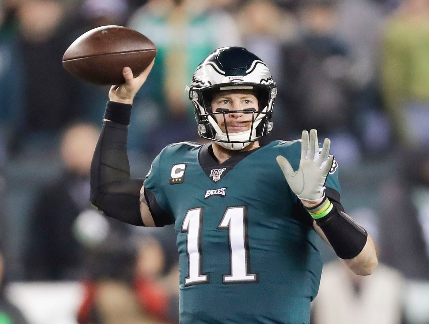 carson wentz unleashes a pass against dallas.