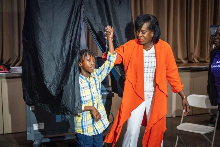 Cherelle Parker and her son, Langston Mullins, 10, after she cast her vote  in Philadelphia on Tuesday.