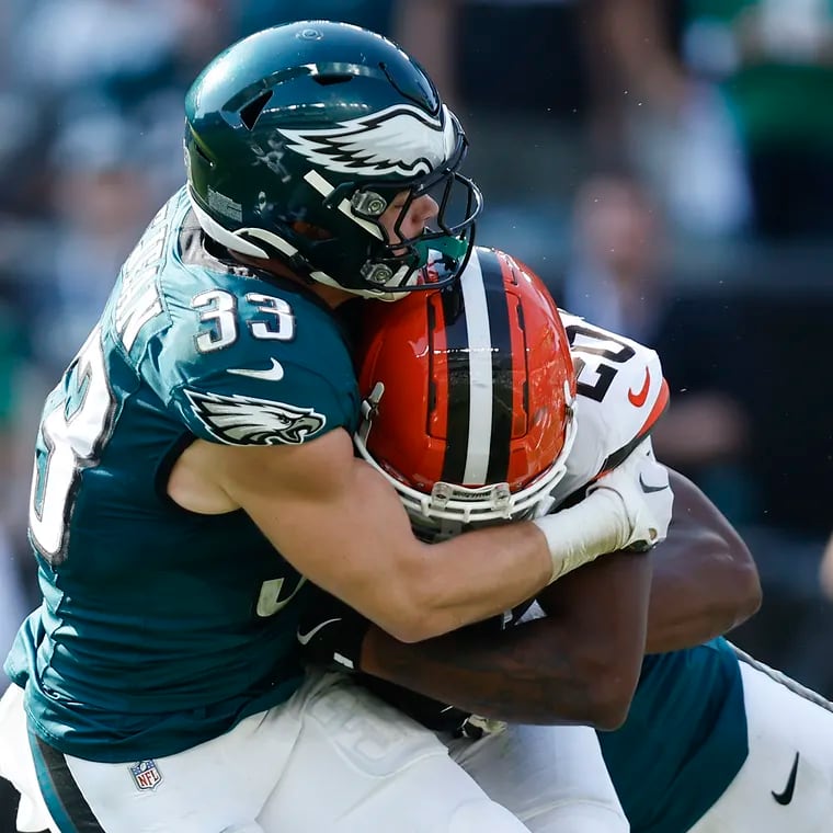 Eagles cornerback Cooper DeJean makes a stop on Cleveland Browns running back Pierre Strong Jr. during Sunday's win.