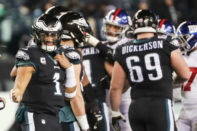 Eagles quarterback Jalen Hurts turns to shake hands with the ref after taking a knee in a win over the New York Giants at Lincoln Financial Field on Sunday, Jan. 8, 2023.