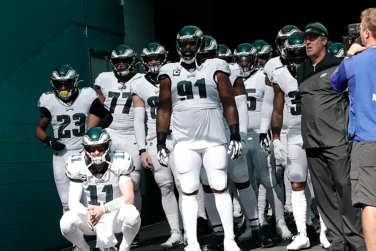 Eagles players wait in the tunnel before playing the Dolphins in Miami.