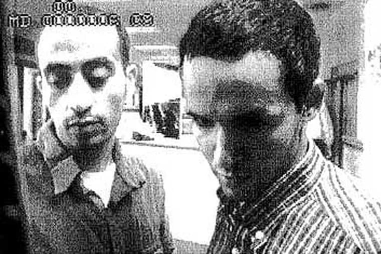 Hani Hanjour (left) and Majed Moqed in a surveillance video on September 5, 2001. Hanjour, a Saudi Arabian  who piloted the plane that was flown into the Pentagon, was the only one of the 19 terrorists in the U.S. on a student visa.