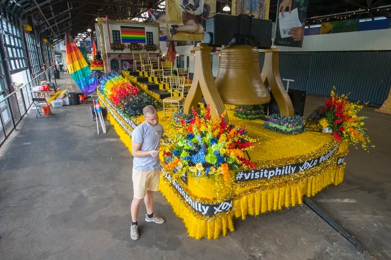 Christian Orr puts some final touches to the Pride Parade float they constructed at Cherry Street Pier; it honors Philadelphia's connection to the Stonewall Riots. on June 7, 2019. The Stonewall Riots took place in 1969 in Greenwich Village.