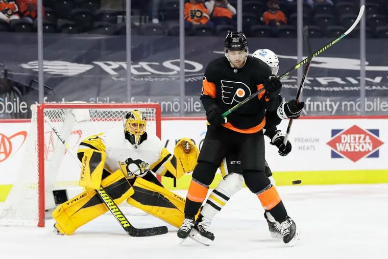 Flyers left winger James van Riemsdyk battles Penguins defenseman Cody Ceci as goaltender Casey DeSmith looks on during a game on May 3. Van Riemsdyk may be left unprotected in the expansion draft.
