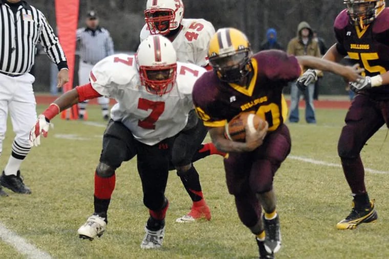 Glassboro&#0039;s Steven Davis eludes Penn Grove&#0039;s Chris Georges to score a touchdown in the fourth quarter. Davis gained 66 yards on 13 carries.