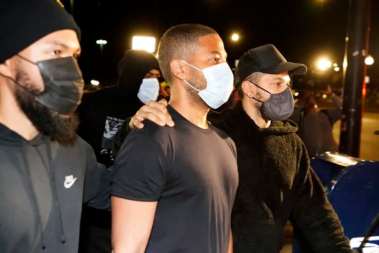 Actor Jussie Smollett (center) leaves the Cook County Jail Wednesday, March 16, 2022, after an appeals court agreed with his lawyers that he should be released pending the appeal of his conviction for lying to police about a hate crime in Chicago.