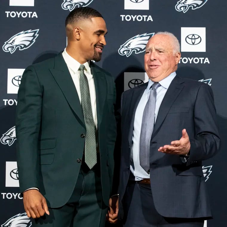 Philadelphia Eagles owner Jeff Lurie (right) is seen here with quarterback Jalen Hurts during a press conference at the NovaCare Complex in 2023.  The photo was taken after Hurts and the Eagles agreed to a five-year, $255 million contract extension.