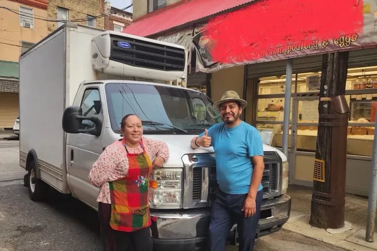 Husband and wife team Alma Romero and Marcos Tlacopilco of South Philadelphia's Alma Del Mar and Marcos' Fish and Crab House restaurants  stand with their replacement refrigerated truck. Their first truck was stolen. A GoFundMe campaign attracted over 300 donors and which helped them purchase a replacement.