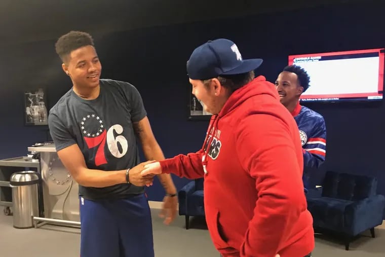 Mike Shelly, 17, of Newtown Square, meets 76ers point guard Markelle Fultz Monday.