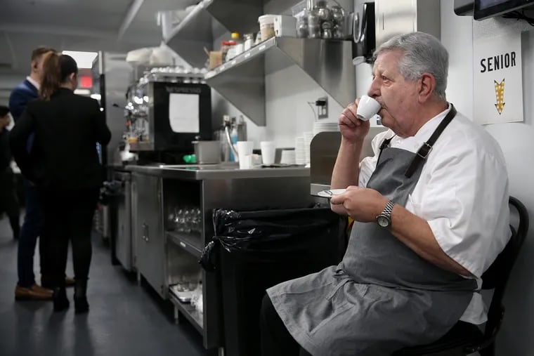Co-owner Vince Termini Sr. sips a cup of espresso while watching the staff from his perch in the kitchen at Giuseppe & Sons.