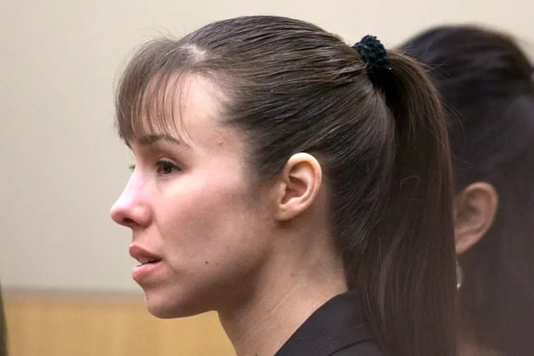 Jodi Arias stands as the jury enters the courtroom before the verdict for sentencing was declared a hung jury for her first degree murder conviction at Maricopa County Superior Court in Phoenix on Thursday, May 23, 2013. The jury in Jodi Arias' trial was dismissed Thursday after failing to reach a unanimous decision on whether the woman they convicted of murdering her one-time boyfriend should be sentenced to life or death in a case that has captured headlines worldwide with its sex, lies, violence. (AP Photo/The Arizona Republic, David Wallace, Pool)