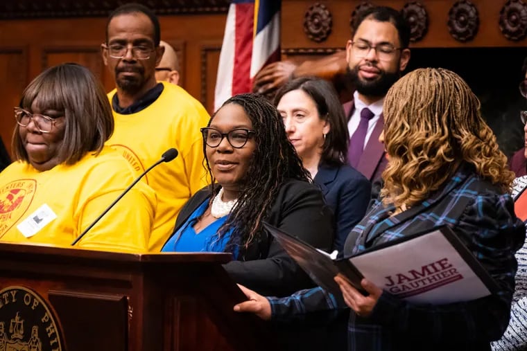 Councilmember Kendra Brooks speaks at a press conference about the Eviction Diversion Program in April. She is surrounded by supporters of the program during a news conference in Philadelphia City Hall.