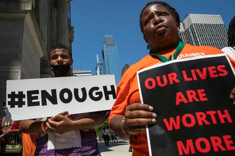 Axzaviyon Clark-Bolden (left) at an anti-violence demonstration at City Hall in May 2022. Students from nine city schools held a rally demanding more support for young people affected by gun violence.