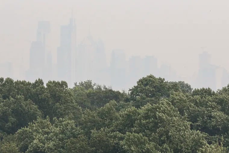 Philadelphia's skyline is hidden behind a thick layer of smoke Tuesday. The haze has been carried across the country from the Pacific Northwest.