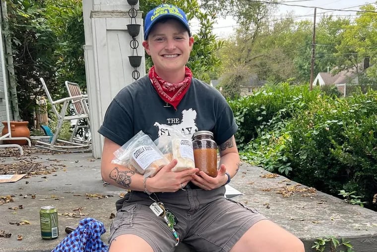 Nashville vegan bakery Guerilla Bizkits sends care packages to locals undergoing gender alignment surgery. Pictured, Cameron Griffith, 24, poses with items from his care package after undergoing top surgery.