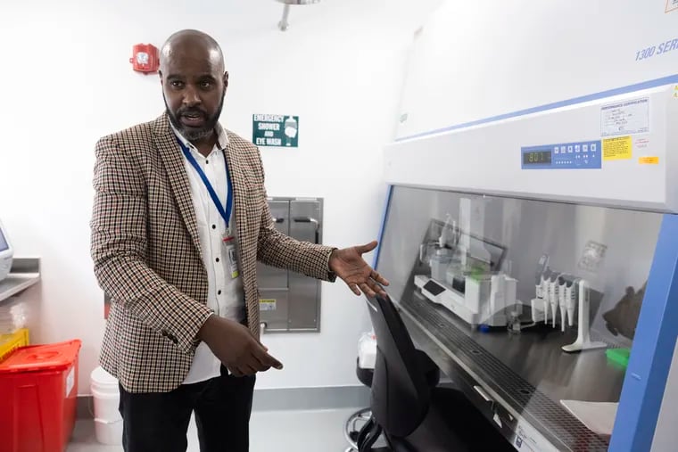 Mazen Sid Ahmed, a molecular microbiology scientist, talks about the machines used for wastewater testing at Philadelphia's Public Health Laboratory on Thursday, July 18, 2024.