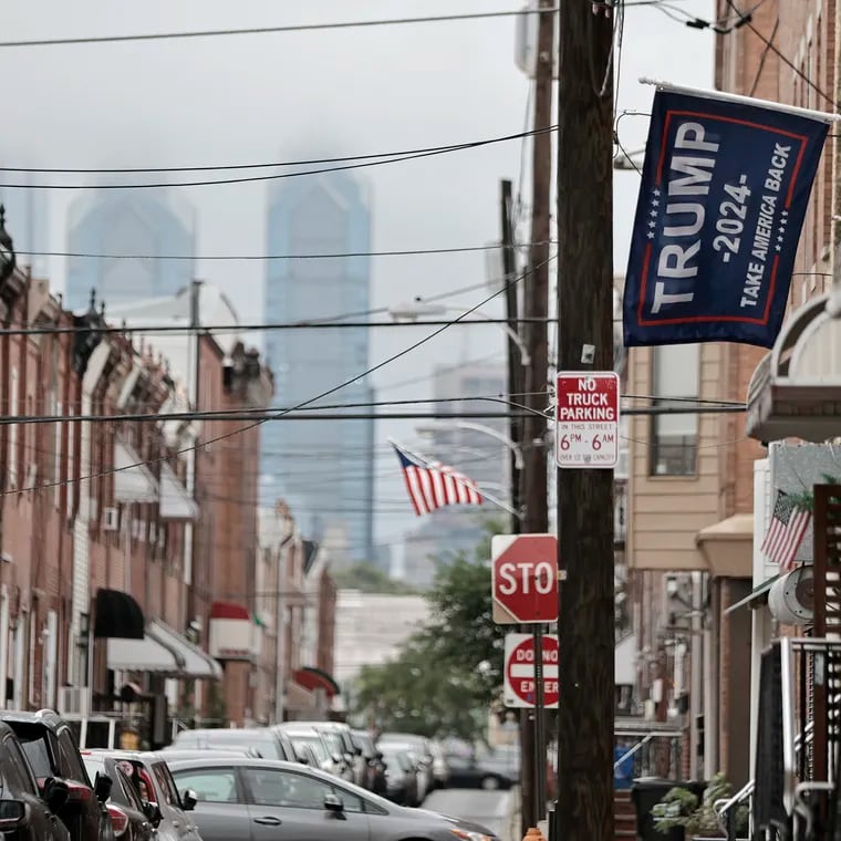 A Trump 2024 flag hangs in front of a rowhouse on South Mole Street in South Philadelphia.