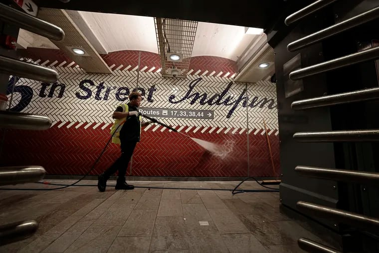 SEPTA’s wash down crew member Carlysle Price power washes the walls at SEPTA’s 5th Street/Independence Hall Station in Philadelphia on Thursday, May 23, 2024.