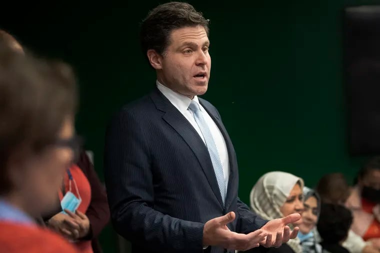 State Rep. Jared Solomon, seen in a 2021 photo welcoming Afghan people being resettled in Philadelphia, said something has to change in the office run by Sheriff Rochelle Bilal, a fellow Democrat.