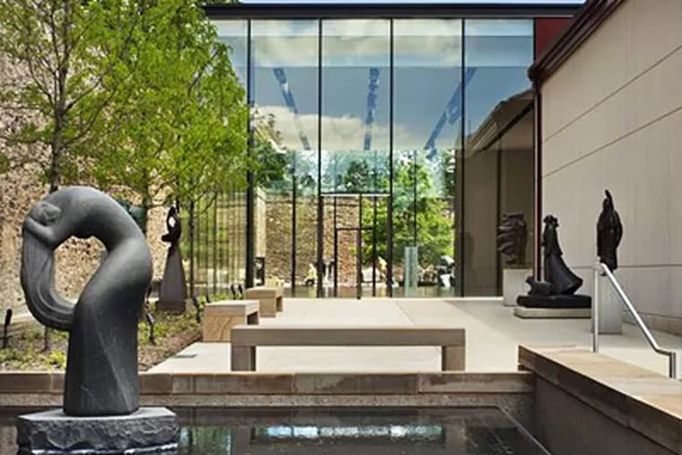 The James A. Michener Art Museum's new pavilion gives those inside an expansive view of the museum's sculpture garden and its reflecting pools. MICHAEL MORAN / Otto