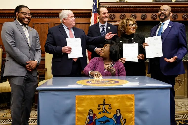 Mayor Cherelle L. Parker signs public safety related bills during a ceremony in April. She is joined by (left to right) Councilmembers Jeffery Young, Jr., Mike Driscoll, Jim Harrity, Quetcy Lozada, and Curtis Jones, Jr. On Tuesday, she signed legislation outlawing bump stocks in the city.