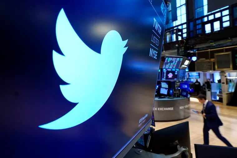 The logo for Twitter appears above a trading post on the floor of the New York Stock Exchange, Nov. 29, 2021. Twitter claims in a lawsuit filed Tuesday in Delaware that Musk's “outlandish” and “bad faith” actions have caused the social media platform irreparable harm and sank its stock price.