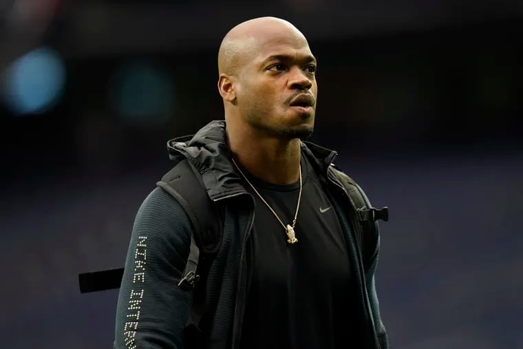 Former NFL running back Adrian Peterson looks on during player arrivals before an NFL football game in Houston in 2021.