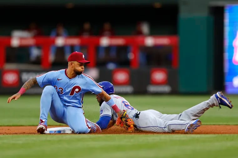 Starling Marte #6 of the New York Mets steals second base ahead of the tag by shortstop Edmundo Sosa #33 of the Philadelphia Phillies in the second inning at Citizens Bank Park on May 16, 2024 in Philadelphia, Pennsylvania. (Photo by Rich Schultz/Getty Images)