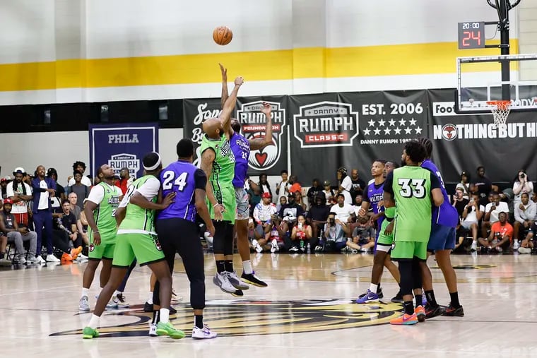 Team Rumph Center in green and Team Foe in blue during the tip-off of the men's championship game at the 19th annual Rumph Classic.