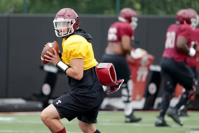 Quarterback Anthony Russo warms up during Owls practice Tuesday.