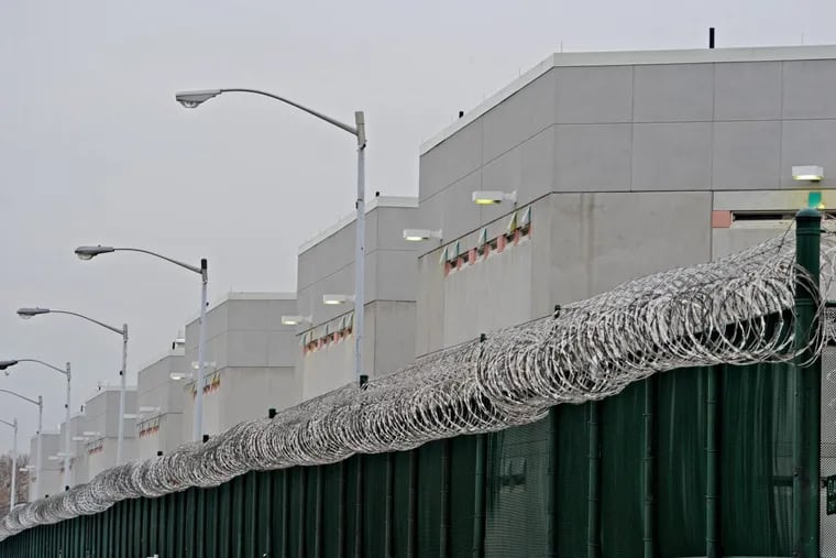 Behind the fence and razor coil wire sits the Curran-Fromhold Correctional Facility, operated by the Philadelphia Department of Prisons, on State Road.