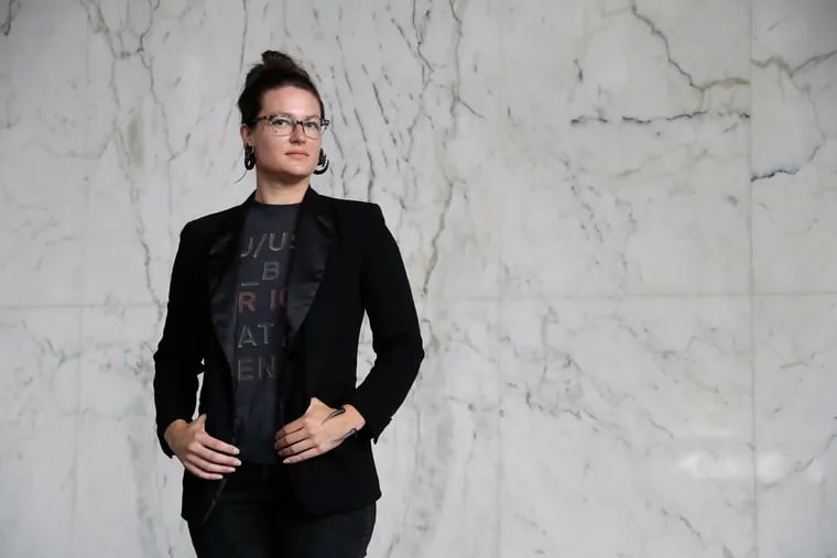 In this Wednesday, June 26, 2019, photo Hannah Moore poses for a portrait in Los Angeles. Moore has struggled to save since graduating from college in December 2007, the same month the Great Recession officially began. She has worked nearly continuously since then despite a couple of layoffs. (AP Photo/Marcio Jose Sanchez)