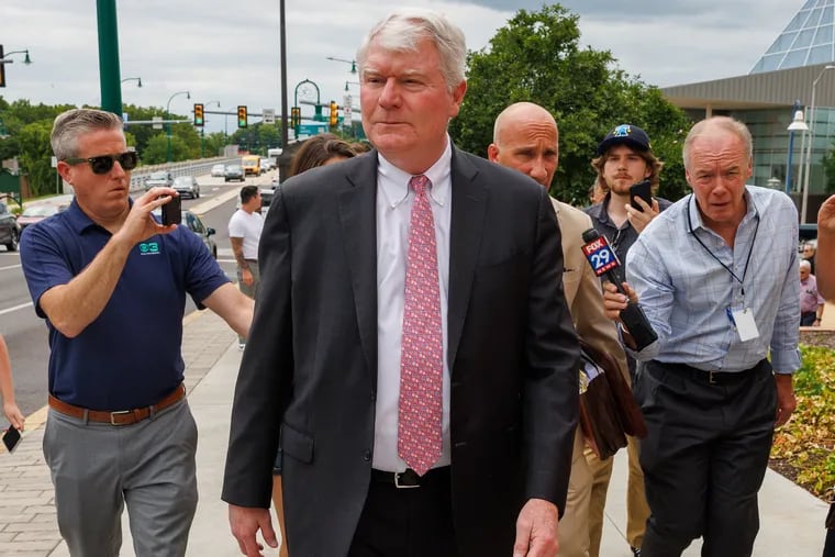 Johnny Dougherty with attorney Gregory J. Pagano as they leave the U.S. District Court in Reading on Thursday.