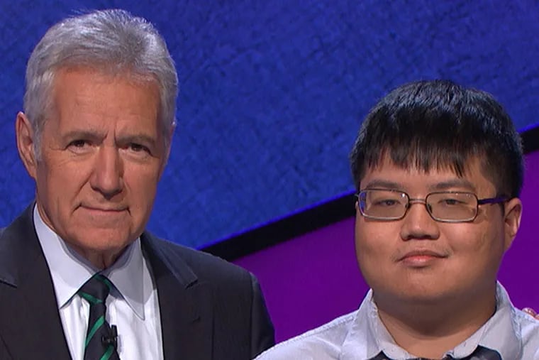 Swarthmore grad Arthur Chu (right) won "Jeopardy!" on Jan. 28, 2014, then had a talked-about tie on Jan. 29 to return on Jan. 30. With him is the show's host, Alex Trebek.