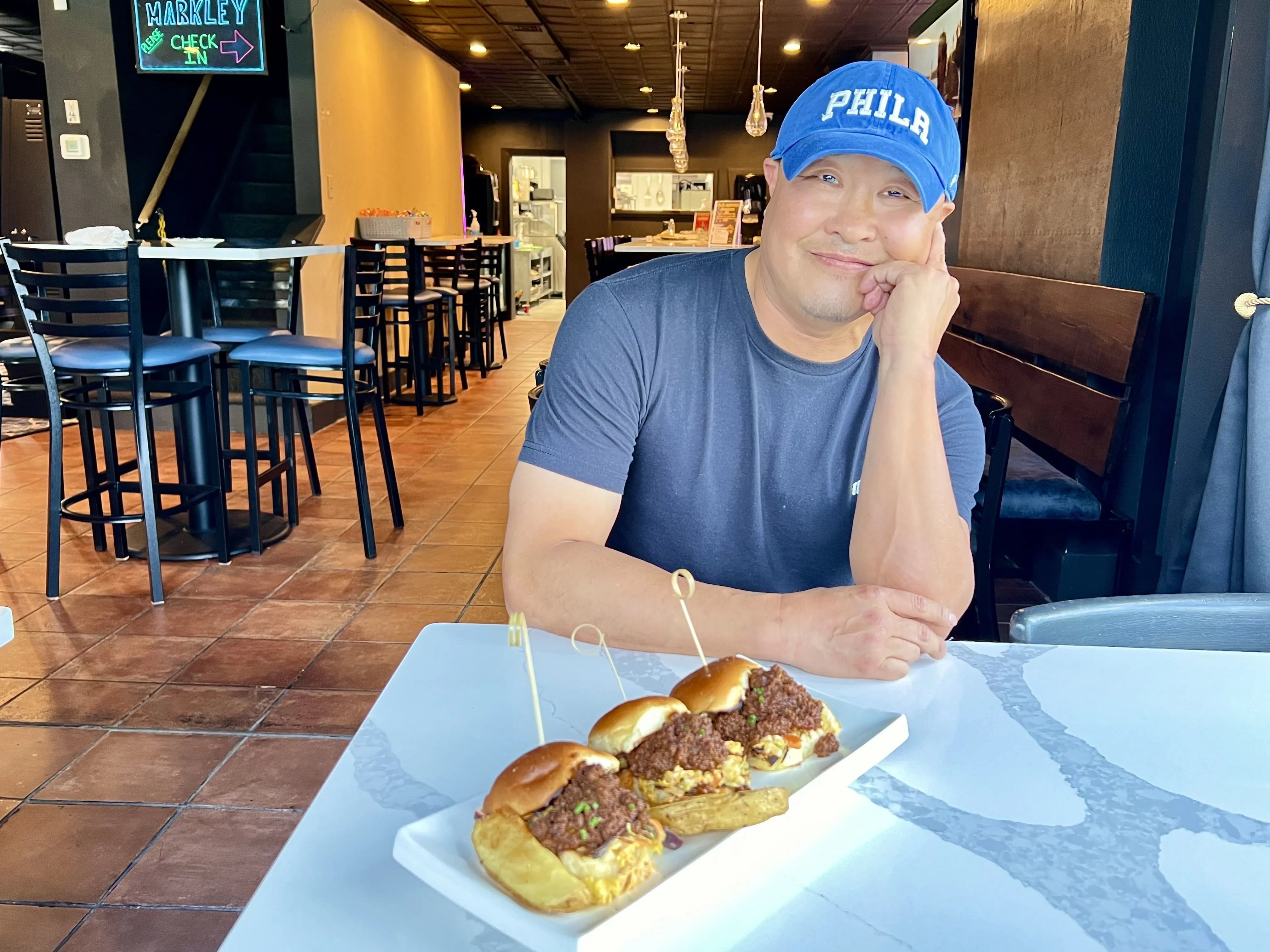Chef Chino Chang with sliders at the Markley, a skill-game arcade at 1729 Markley St. in Norristown.