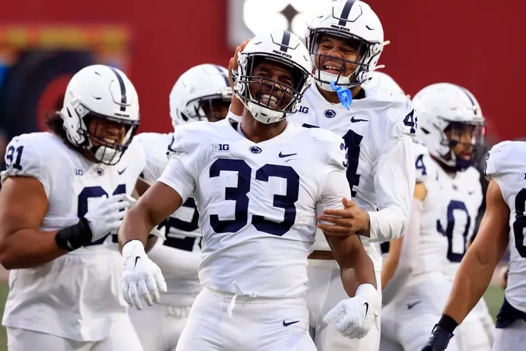 Penn State defensive end Dani Dennis-Sutton (center) celebrates with teammates after his interception in last week's game at Indiana. The Nittany Lions defense has held six of nine opponents to 17 points or less. (Photo by Justin Casterline/Getty Images)