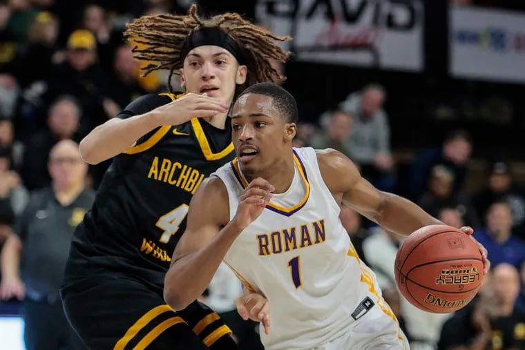 Roman’s Xzayvier Brown drives on Wood’s Deuce Maxey during the Catholic League semifinal boys basketball game at the Palestra.