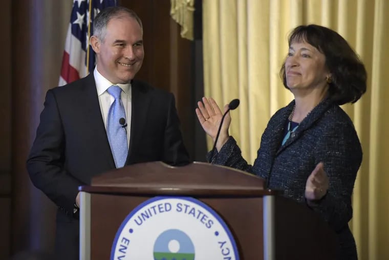 Environmental Protection Agency Administrator Scott Pruitt smiles as he is introduced by acting EPA Administrator Catherine McCabe in Washington on Feb. 21, 2017.