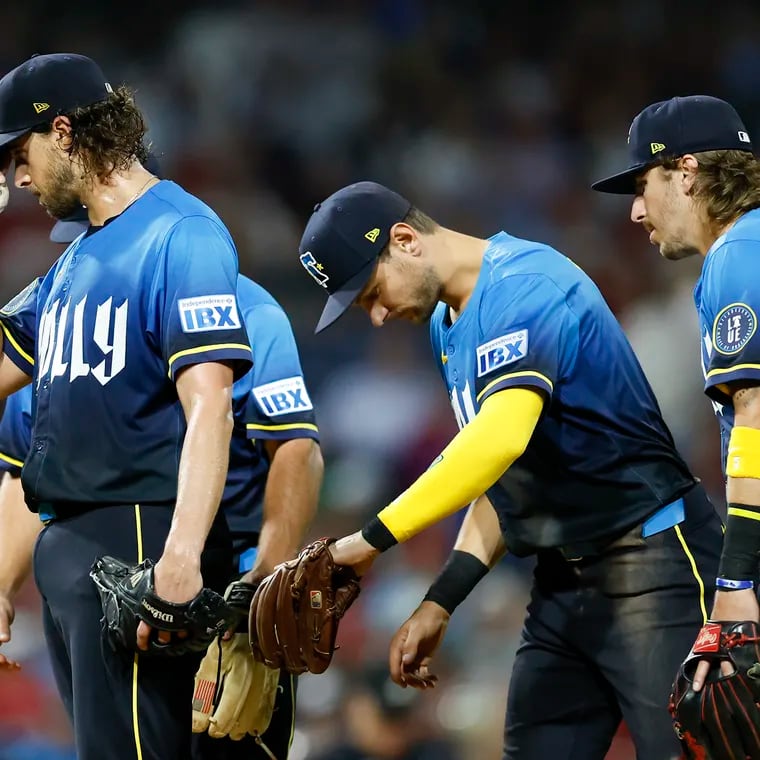 Phillies pitcher Aaron Nola reacts before getting replaced after giving-up six run to the Mets in the fifth inning.