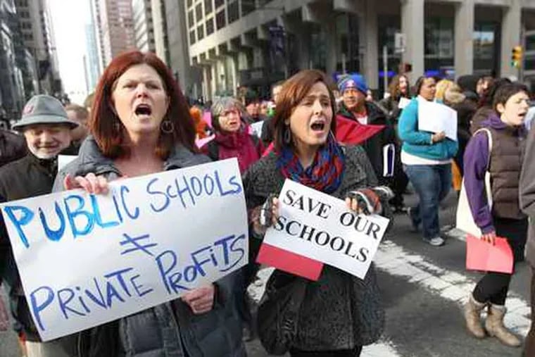 File photo: Protesters, including school nurse and PCAPS member Eileen Duffey (left) rallied in December 2012 against school closings. (Michael Bryant/Staff Photographer)