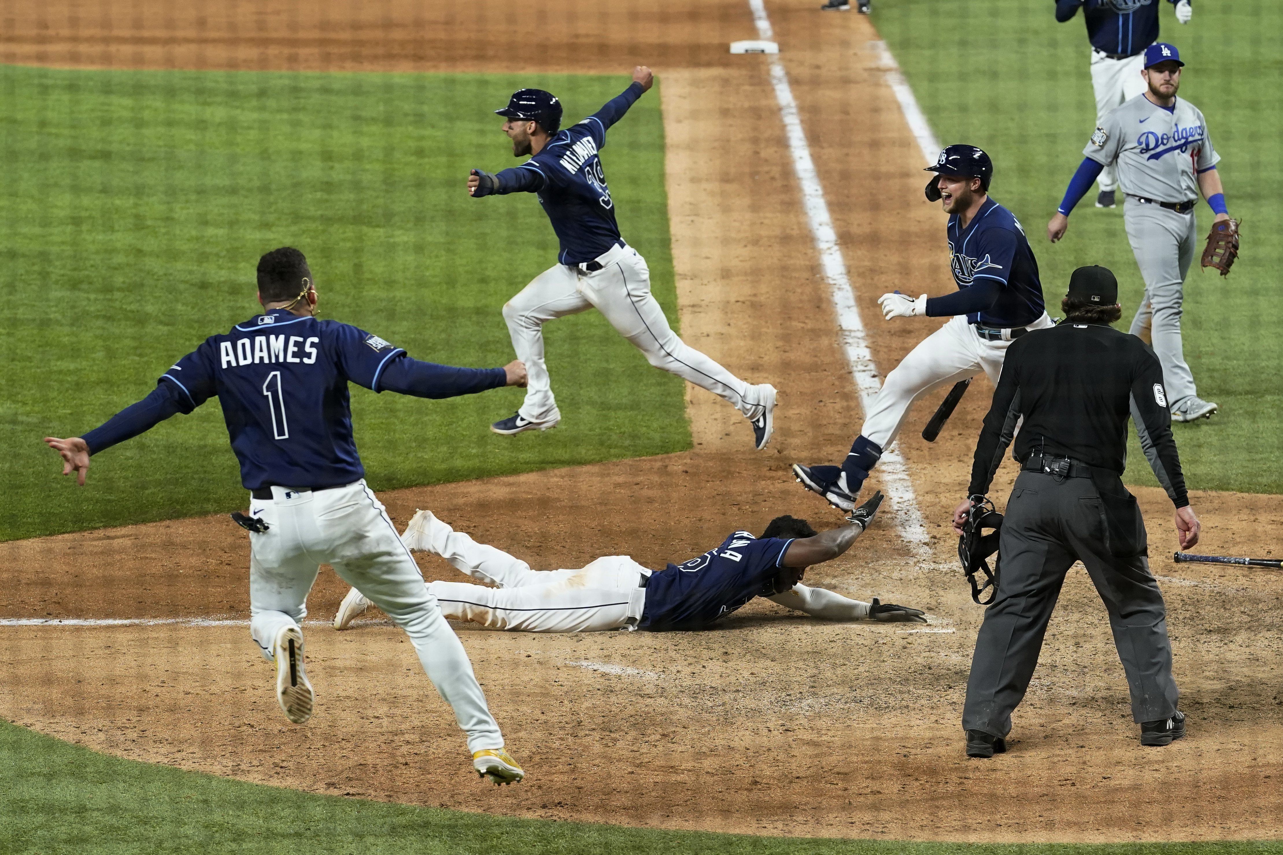 Photos: Randy Arozarena lays on home plate after game-winning run, Rays  celebrate victory over Dodgers