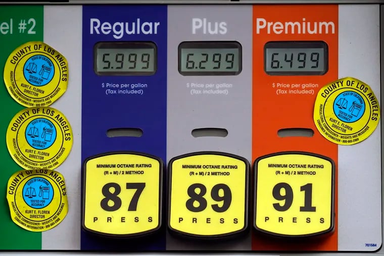 High gas prices are posted at a full service gas station in Beverly Hills, Calif.