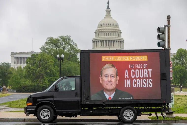 A mobile billboard showing Supreme Court Chief Justice John Roberts is seen outside the U.S. Capitol on April 28, 2023, in Washington, D.C.