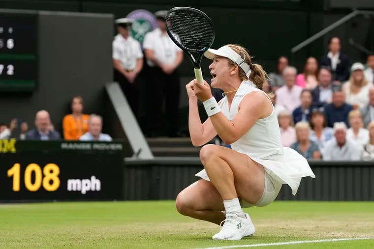 Lulu Sun of New Zealand celebrates after defeating Emma Raducanu of Britain in their fourth round match at the Wimbledon tennis championships in London, Sunday.