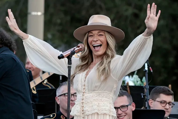 LeAnn Rimes greets the audience as she arrives on stage with the U.S. Army Field Band & Soldiers’ Chorus. The performance, on Independence Mall, was part of the Wawa Welcome America festivities in Philadelphia on Wednesday.