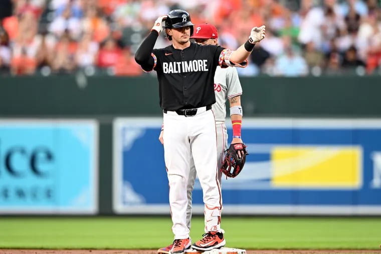 Adley Rutschman #35 of the Baltimore Orioles celebrates after driving in a run with a double in the third inning against the Philadelphia Phillies at Oriole Park at Camden Yards on June 14, 2024 in Baltimore, Maryland. (Photo by Greg Fiume/Getty Images)