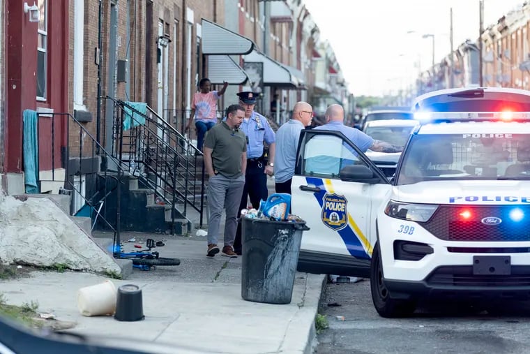 Police and detectives are shown on the scene of a shooting at the 2800 block of North Bambrey and Somerset Streets in North Philadelphia on Wednesday.