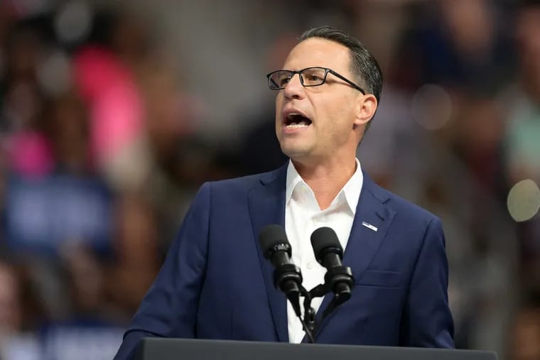 Pa. Governor Josh Shapiro introduces Vice President Kamala Harris and her running mate  Minnesota Governor Tim Walz, during a rally at Temple University, on Tuesday, Aug. 6.