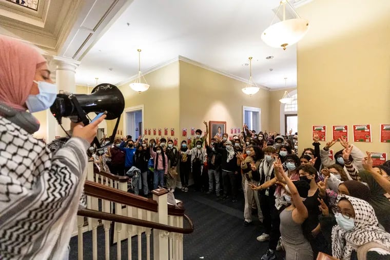Students gather at the first floor for a News Hour during their sit-in Friday at Parrish Hall at Swarthmore College.