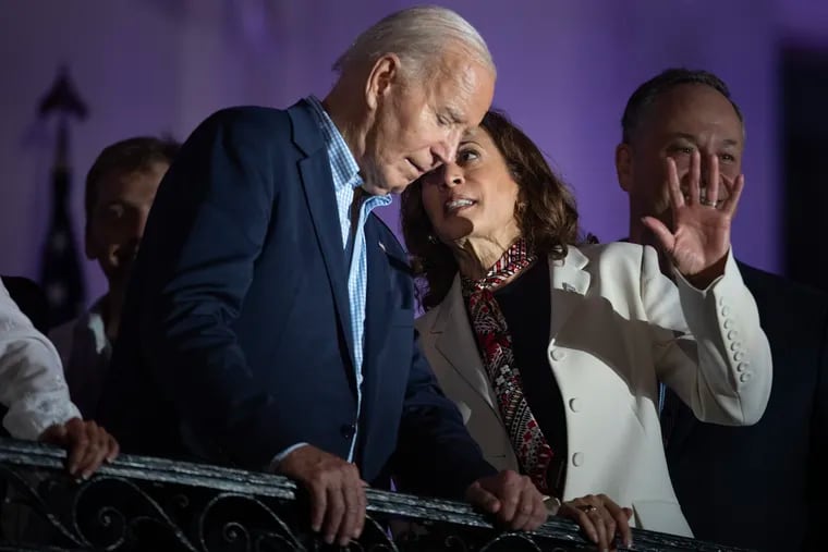 President Biden and Vice President Harris talk while watching a fireworks display on July 4 at the White House.